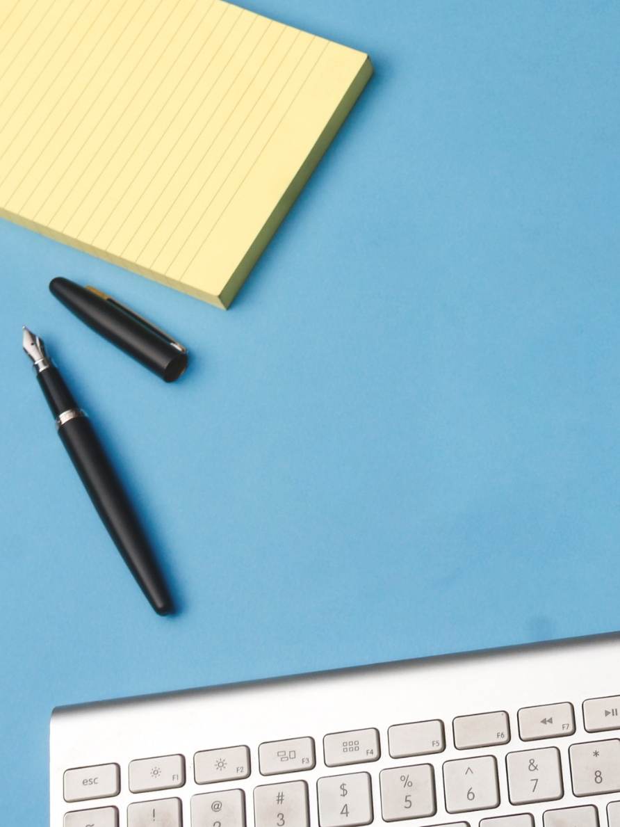 Image of paper and a quill ballpoint pen representing how you can fuel your business growth with the help of a network management software like Intoto.